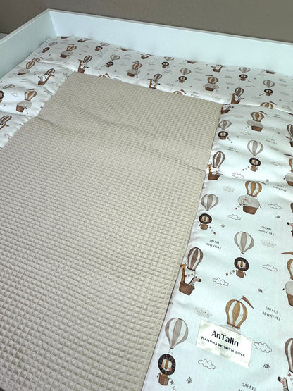 Wickelauflage über den Wolken